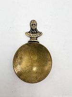 front view showing bust handle and bowl