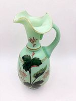 Front view showing floral design and ruffled spout