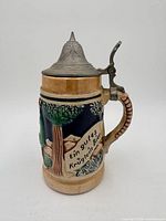 Right profile showing relief scene and inscription