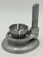 side view showing base, egg cup and vertical arm