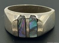 Front view of sterling silver signet ring with twin abalone inlays