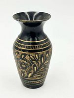 Front view of black enamel hand-etched brass miniature vase