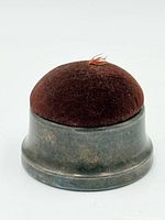 Front view of assembled metal base pin cushion with velvet dome