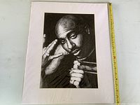 Full view of matted Tupac print with tape for scale