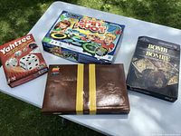 Group shot showing all four boxed games on table