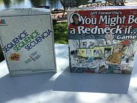 Sequence and Redneck game boxes front view