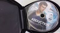 Abduction DVD in binder sleeve