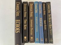 Spine view of all seven Danielle Steel hardcovers