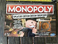 Front of sealed Monopoly Cheaters Edition box