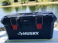 Front view of Husky toolbox showing latches and logo