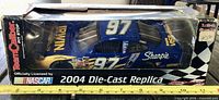 Front perspective of boxed Team Caliber die-cast car showing number 97 and Irwin Tools branding