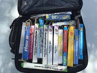 Open lunch box showing multiple card and flash card boxes inside