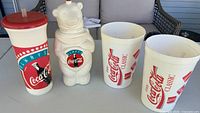 Overall view of all four Coca-Cola drinkware items