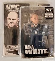 Front view of sealed Dana White action figure in UFC Ultimate Collector packaging