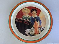 Full view of round Orange Crush tin tray front