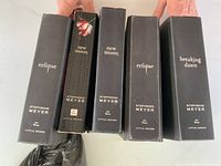 Spines of five Twilight Saga books showing titles and dust jackets