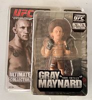 Front of sealed blister pack showing figure and UFC branding