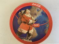 Full view of round Coca-Cola Santa metal tray front side