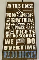 Full view of wooden sign showing all text and graphics