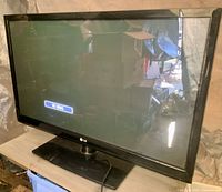 Front view of LG TV displaying 'No Signal' message