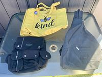 Overall view showing Candie’s backpack and yellow tote