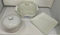 All three pieces: Corning Ware Blue Cornflower casserole with lid, round white casserole with lid, white square baker