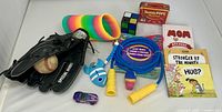 Entire lot overview showing glove, ball, toys, books