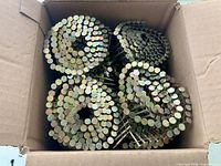 Open box showing coils of nails
