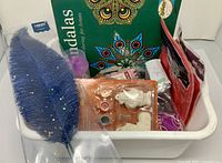 Tub containing assorted craft items