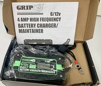 Charger in box with instruction manual and leads