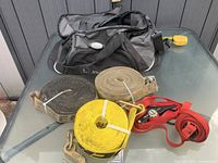 Duffle bag with five straps displayed on table