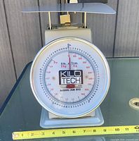 Front view of Kilotech mechanical scale showing full dial and platform