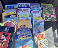 Front view of upright books showing multiple titles inside crate