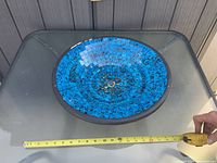 Top view showing full mosaic pattern and tape for scale