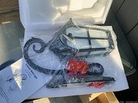 Fixture in protective packaging with components and manual