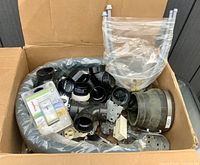 Entire contents in box showing fittings, hose, dimmer pack, rubber coupler and hardware