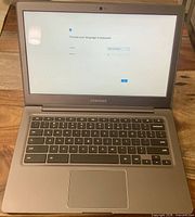 Open Chromebook showing setup screen and keyboard layout