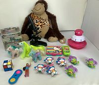 Group view of all toys and plush monkey