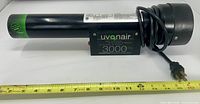 Side profile showing full length of Uvonair 3000 with measuring tape and power cord
