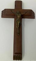 Front view of wooden crucifix with metal corpus