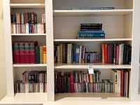 Full bookshelf view showing CDs and books