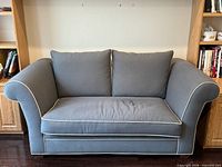 front view of grey loveseat