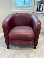 Front view of burgundy leather tub chair