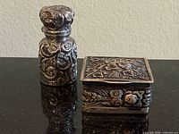 Front view of sterling scent bottle and pill box