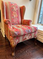 Front view of Queen Anne floral wing chair