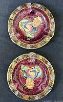 Top view showing both ashtrays, pattern and gilt borders visible