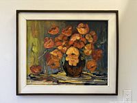 Framed oil painting on wall