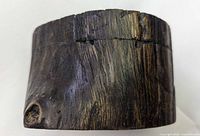 Front view showing natural knot and lid seam