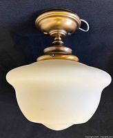 Ceiling lamp assembled showing shade and mount