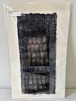 Front view of sealed mixed media painting showing abstract design and signature